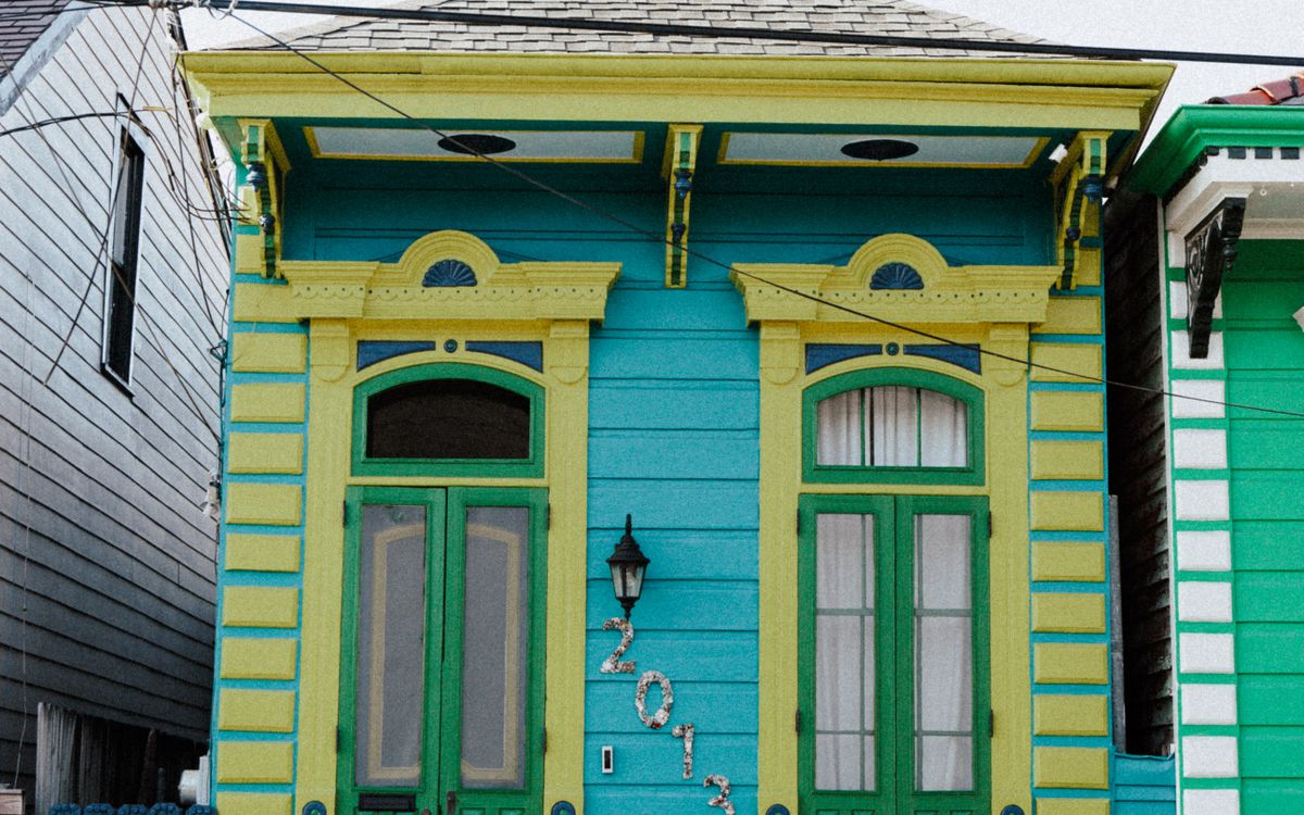 Colorful raised New Orleans shotgun house