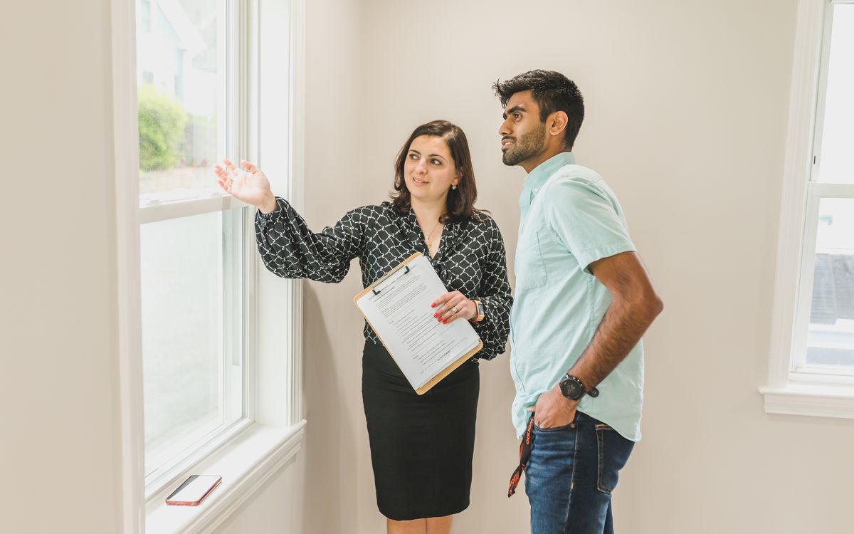 Inspector reviewing documentation with a homeowner during a walkthrough
