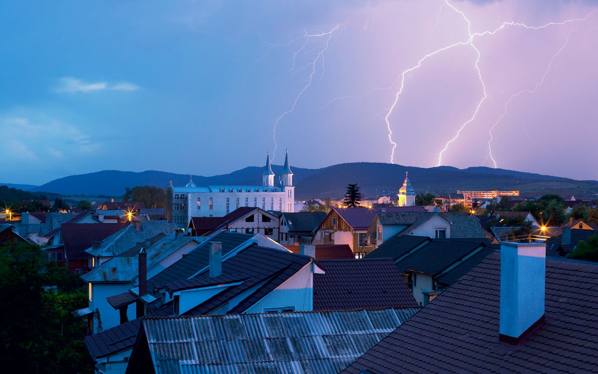 Lightning storm over rooftops during a Gulf Coast storm