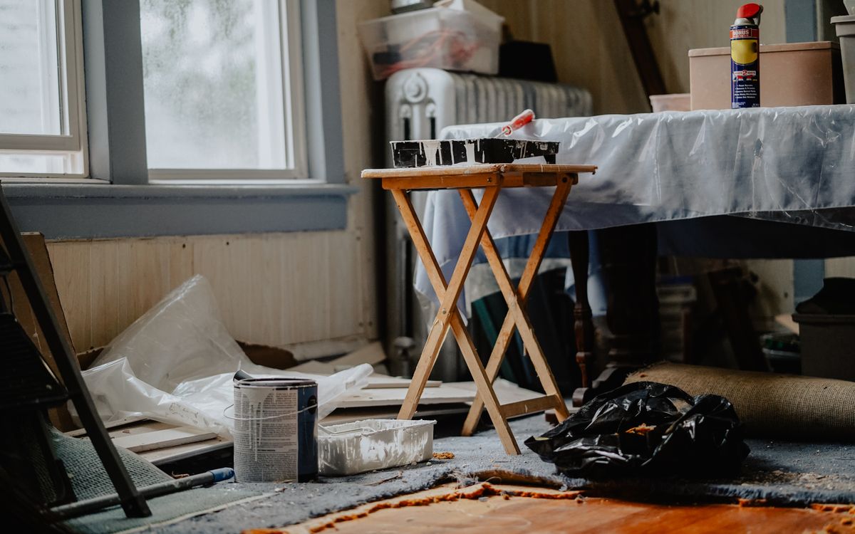Home interior mid-restoration with repair work underway